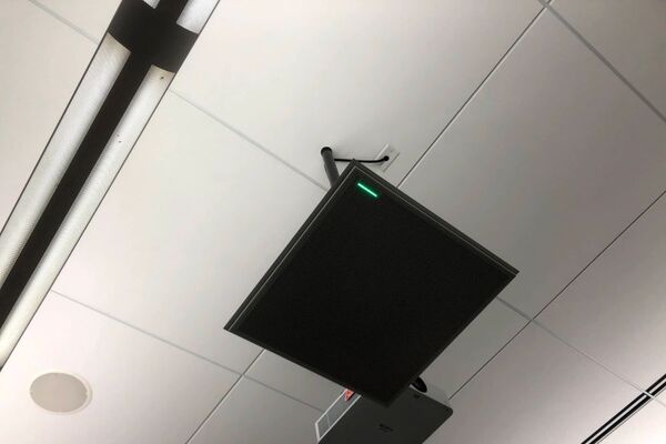 microphone tile-mounted in the ceiling to provide microphone coverage over student seating