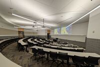 Front of room view with lectern center in front of markerboard 