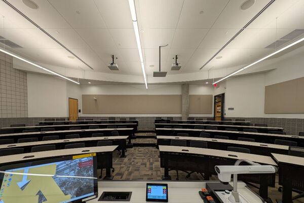 Front of room view with lectern center in front of markerboard 