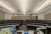 Front of room view with lectern center in front of markerboard 