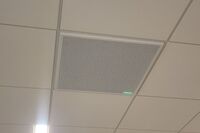 microphone tile-mounted in the ceiling to provide microphone coverage over student seating