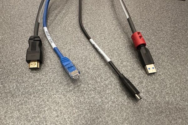 Pedestal - laptop cable connections with cables pulled out showing cable ends