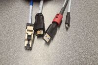 Pedestal - laptop cable connections with cables pulled out showing cable ends