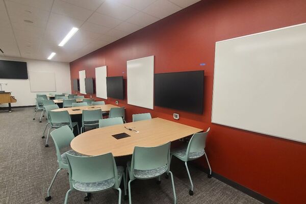 Front of room view with lectern center in front of markerboard 