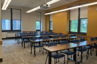 Back of room view of tables and chairs