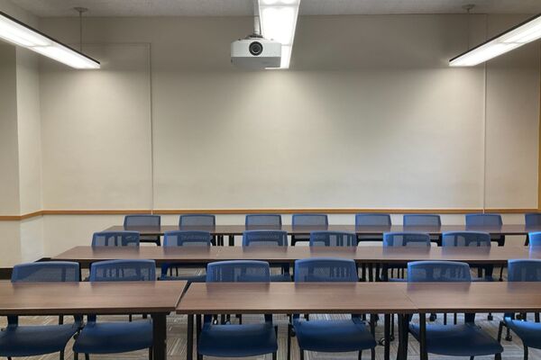 Back of room view of tables and chairs