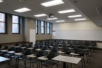 Back of room view of student tablet arm seating 