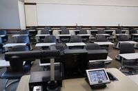 Back of room view of student tablet arm seating 