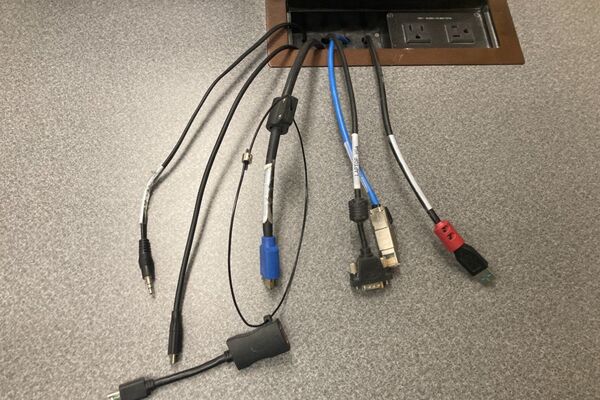 Pedestal - laptop cable connections with cables pulled out showing cable ends