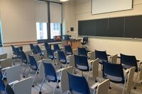 Front of room view with lectern on left in front of chalkboard