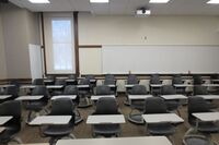 Back of room view of student tablet arm seating 