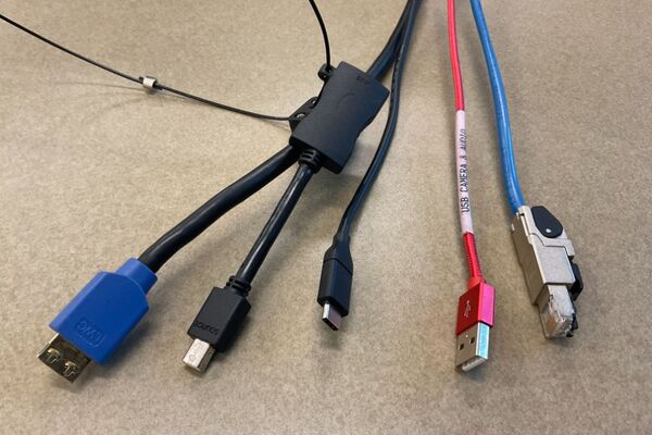 Pedestal - laptop cable connections with cables pulled out showing cable ends