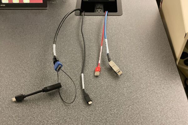 Pedestal - laptop cable connections with cables pulled out showing cable ends