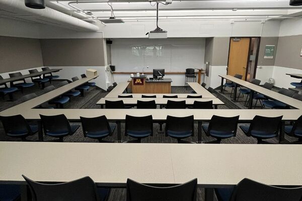 Front of room view with lectern center in front of markerboard 