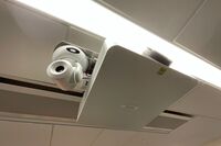 Camera mounted to ceiling and instructor enabled adjustments to the lens to allow the instructor to be "seen" by the camera in more locations around the room