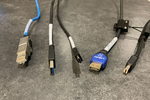 Pedestal - laptop cable connections with cables pulled out showing cable ends