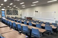 Front of room view with lectern in front of markerboard