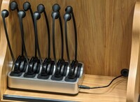 Pedestal - view of assistive listening devices in charger