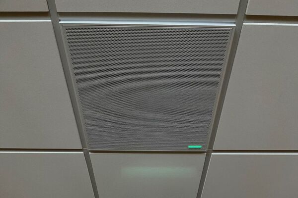 White 2¿ x 2¿ tile mounted in the ceiling to provide microphone coverage over student seating