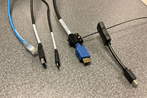 Pedestal - laptop cable connections with cables pulled out showing cable ends