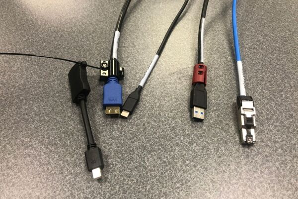 Pedestal - laptop cable connections with cables pulled out showing cable ends