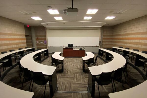 Front of room view with lectern center in front of markerboard