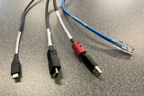 Pedestal - laptop cable connections with cables pulled out showing cable ends