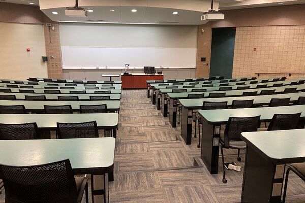 Front of room view with lectern center in front of markerboard