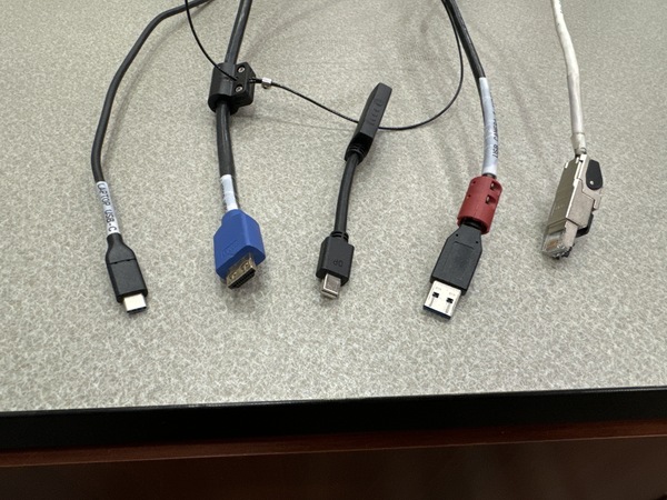 Pedestal - laptop cable connections with cables pulled out showing cable ends