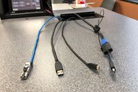 Pedestal - laptop cable connections with cables pulled out showing cable ends