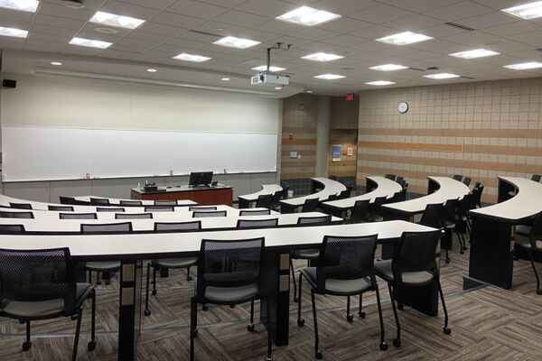 Front of room view with lectern center in front of markerboard 