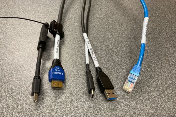 Pedestal - laptop cable connections with cables pulled out showing cable ends