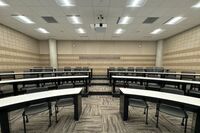 Back of room view of student tiered fixed-table and chair seating