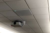 Camera mounted to ceiling and instructor enabled adjustments to the lens to allow the instructor to be "seen" by the camera in more locations around the room