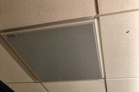 White 2¿ x 2¿ tile mounted in the ceiling to provide microphone coverage over student seating