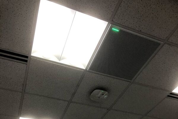 White 2¿ x 2¿ tile mounted in the ceiling to provide microphone coverage over student seating