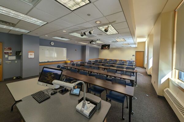 Back of room view of tables and chairs