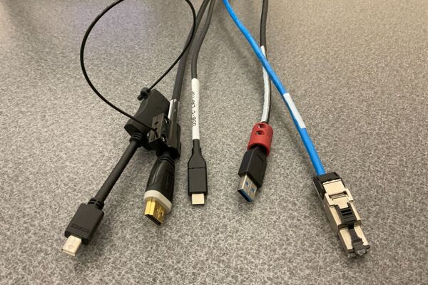 Pedestal - laptop cable connections with cables pulled out showing cable ends