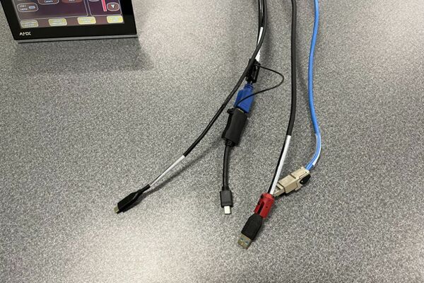 Pedestal - laptop cable connections with cables pulled out showing cable ends