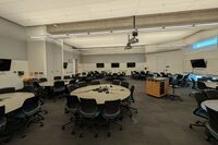 Back of room view of group table and chair seating