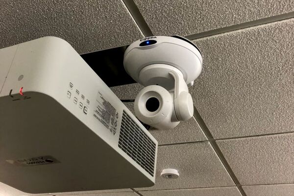 Camera mounted to ceiling and instructor enabled adjustments to the lens to allow the instructor to be "seen" by the camera in more locations around the room