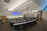 Front of room view with lectern center in front of markerboard 