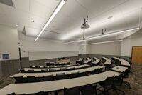 Front of room view with lectern center in front of markerboard 