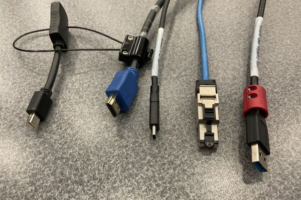 Pedestal - laptop cable connections with cables pulled out showing cable ends