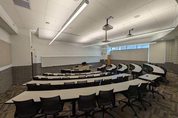 Front of room view with lectern in front of markerboard 