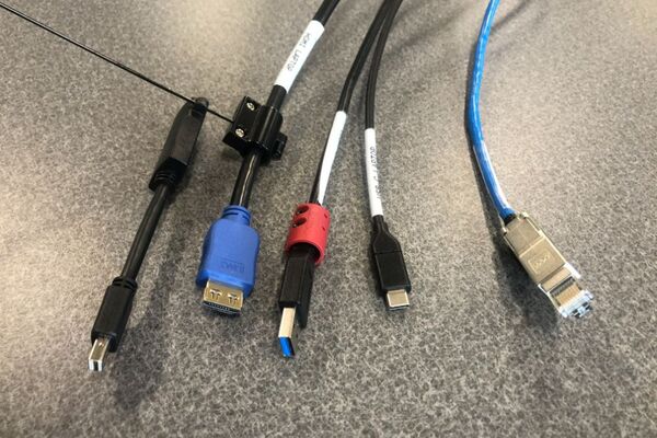 Pedestal - laptop cable connections with cables pulled out showing cable ends