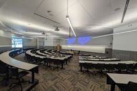 Front of room view with lectern center in front of markerboard 