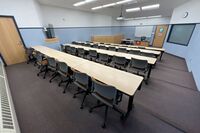 Front of room view with lectern center in front of markerboard