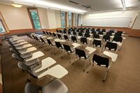  Front of room view with lectern on left in front of markerboard