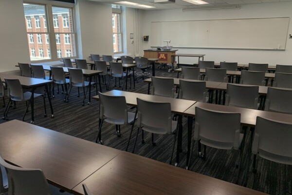 Front of room view with lectern on left in front of markerboard 